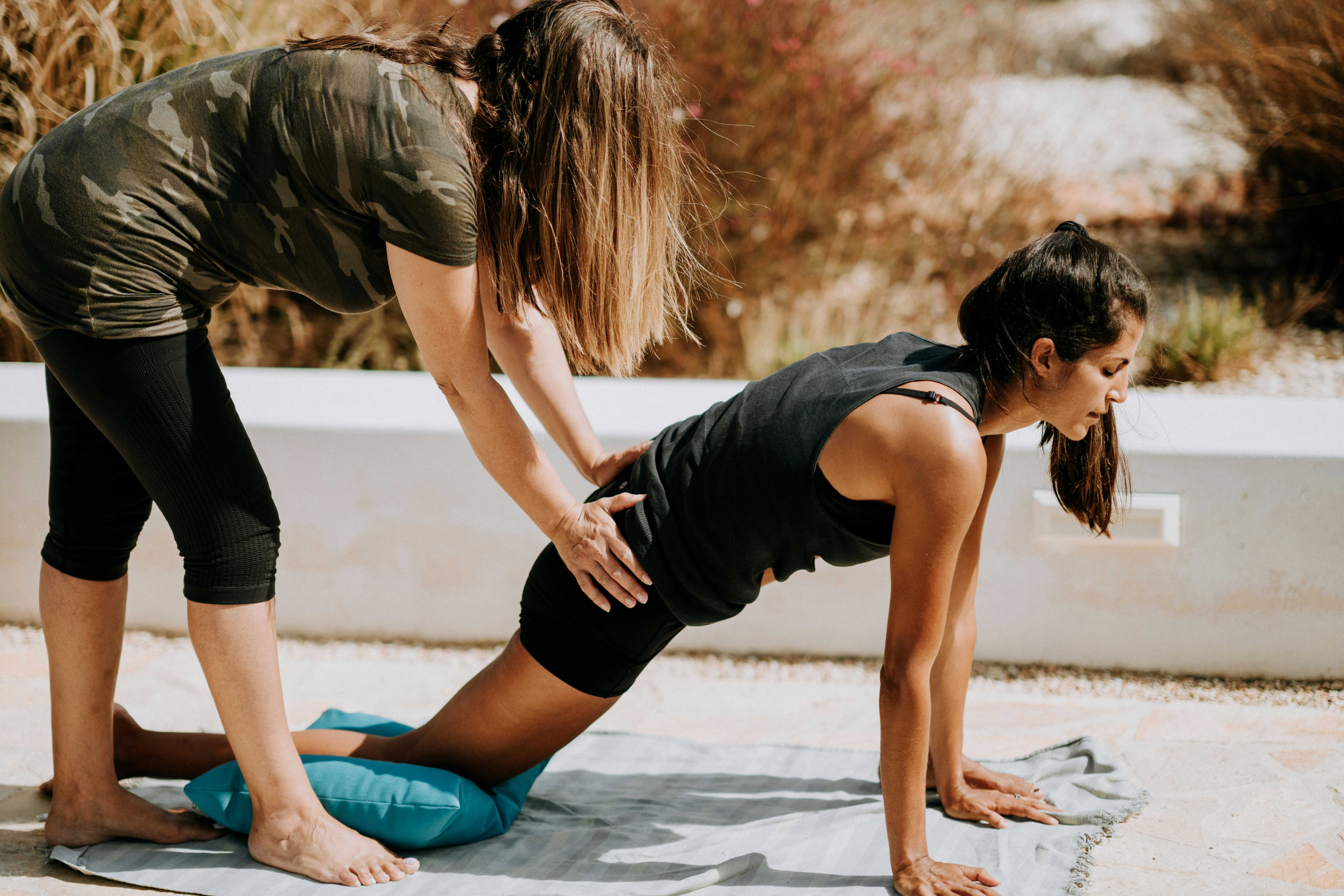a kinesiologist guiding a movement exercise.